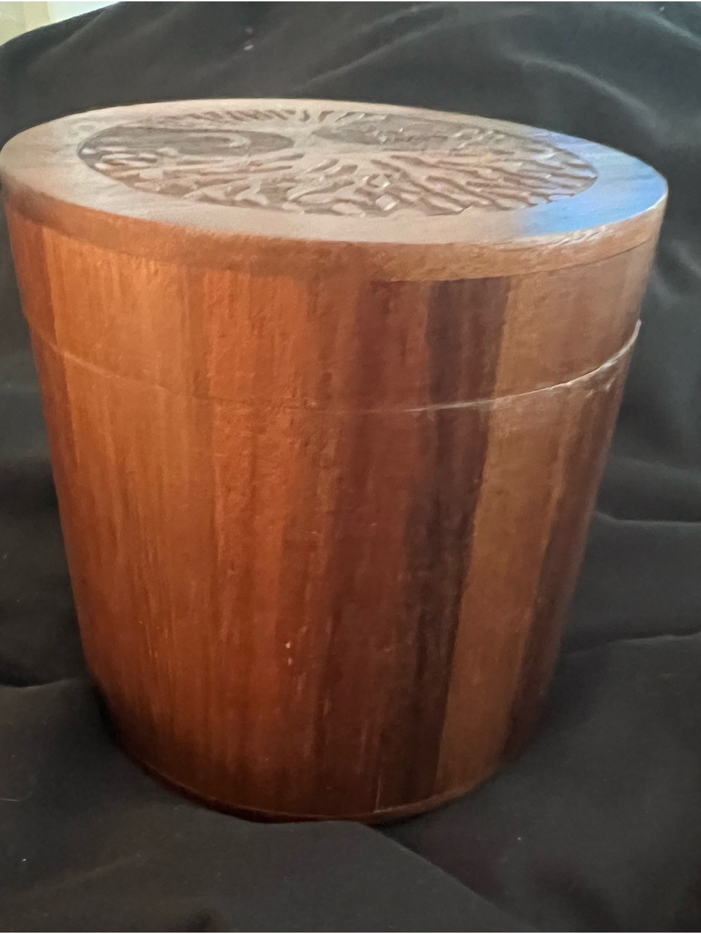 Wooden Urn with tree of life with moon and sun on the top.